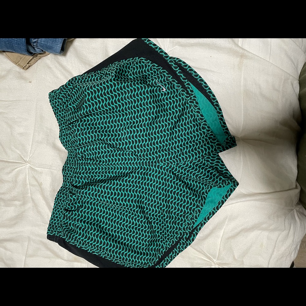 Teal & black Nike shorts.